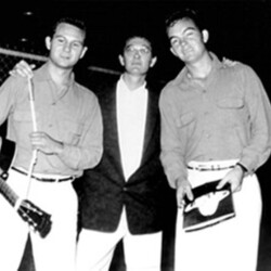 ca Spring 1956. This was taken in Odessa Texas of me, Buddy Holly and Don Guess (The Three Tunes bassist). We were booked on a tour of Oklahoma and Texas to open for Faron Young, Carl Perkins, Wanda Jackson, Sonny James, and Tommy Collins. We did our new Decca record, "Blue Days, Black Nights" and "Love Me." We also served as backup band for Sonny and Tommy. The tour ended in Odessa.
Later that year in August, as Buddy was playing more and more lead and developing that powerful style, I left the group and went on the road with Slim Whitman. It was rather a short-lived gig and I don't have any pictures, but it was a great experience. Slim was a real good ol' boy and his songs like "Indian Love Call" and "Rose Marie" were great fun to play.