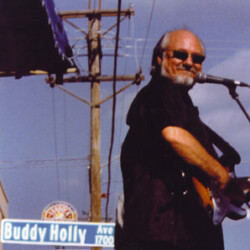 Performing with the Crickets (J.I. Joe B. and me) on Buddy Holly Avenue in Lubock, Texas. Photo by Steve Bonner