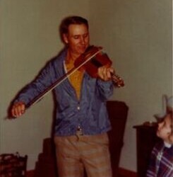ca 1966. This is my brother, Dean, playing the fiddle at Christmas time at Pete and Glena’s house in Meadow. That’s his little girl, my sweet niece, Nicole, looking at him adoringly. And adorable, he was, as well as the best ol’ boy in the world. We lost him in 1976. He and I were best ol’ buddies and I miss him to this day. Sonny's brother Dean playing fiddle
