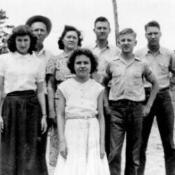 ca 1950. My family, except for Mae, visiting my dad's childhood stompin' ground near Hot Springs, Arkansas. Clockwise are Daddy, Mama, Pete, me, Dean, Jean and Alene. We were having a lots of fun (as you can see) and just couldn't wait for them to snap this picture so we could get back to jumpin' up and down and laughing and having a good time. Sonny's family